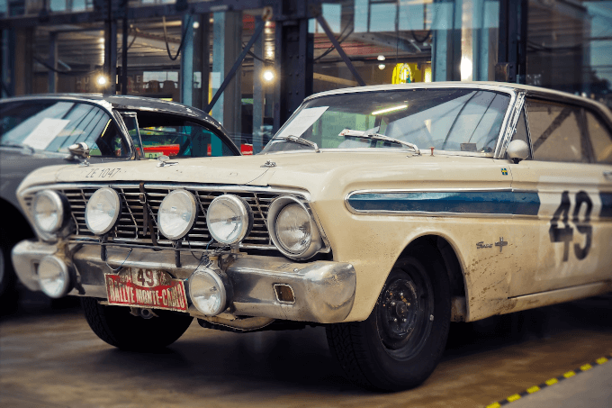 Vintage car parked inside an auto garage